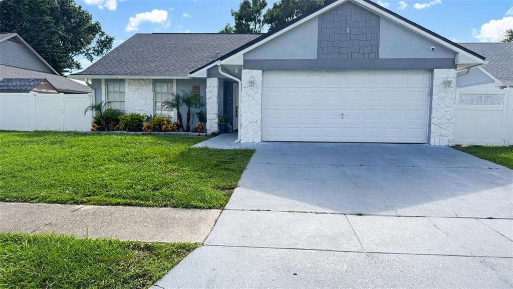 7102 HOLLOWELL DRIVE TAMPA, FL 33634